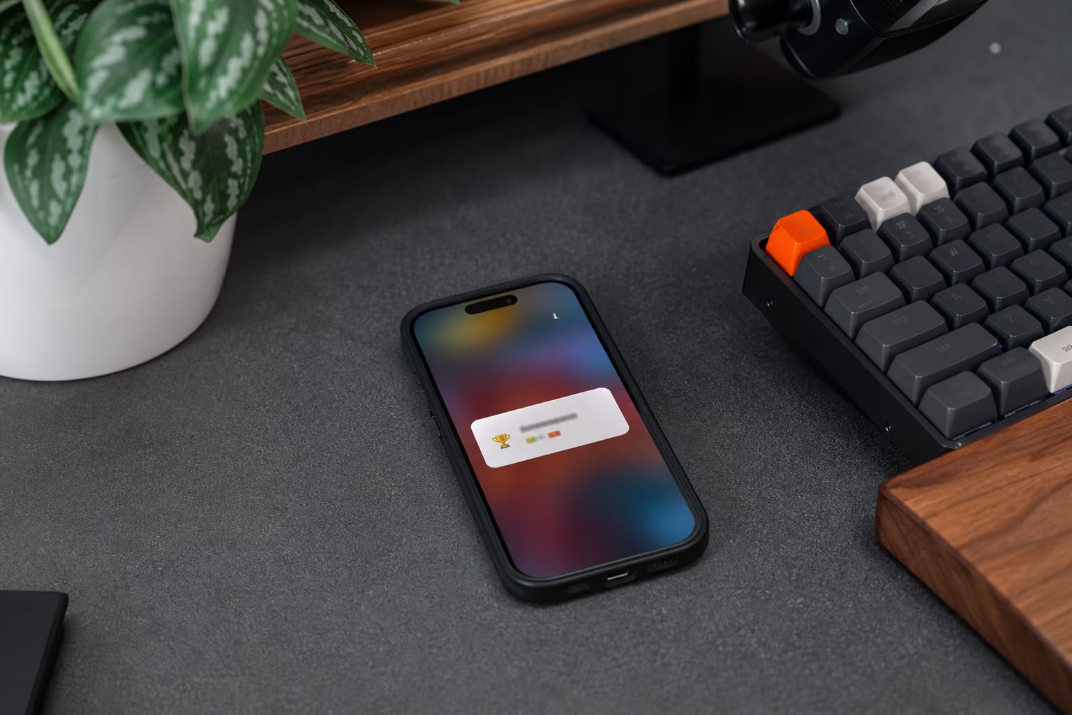 Phone on a desk displaying a mobile alert about a search ranking change.