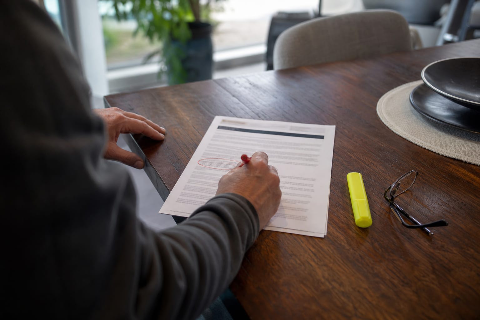 Printed web page with a red pen circling a short two-sentence answer directly under a heading.